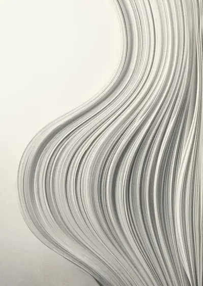 Pliegues de papel formando una onda continua.